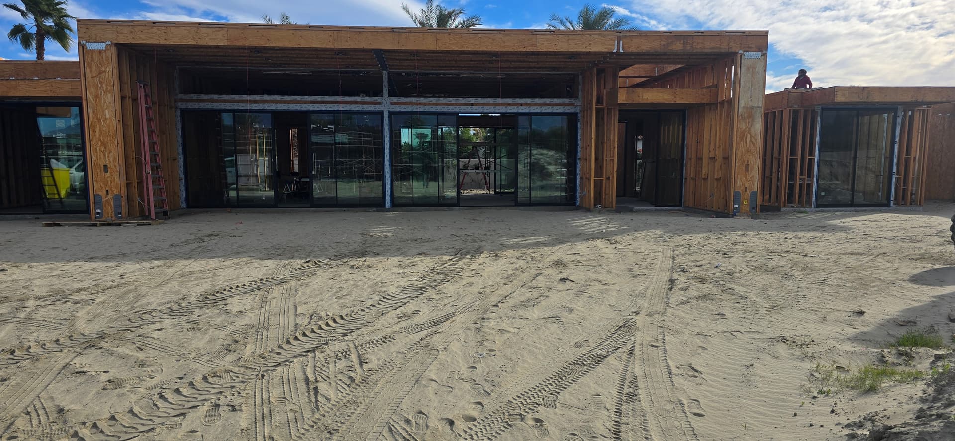 Commercial-scale sliding glass storefront
