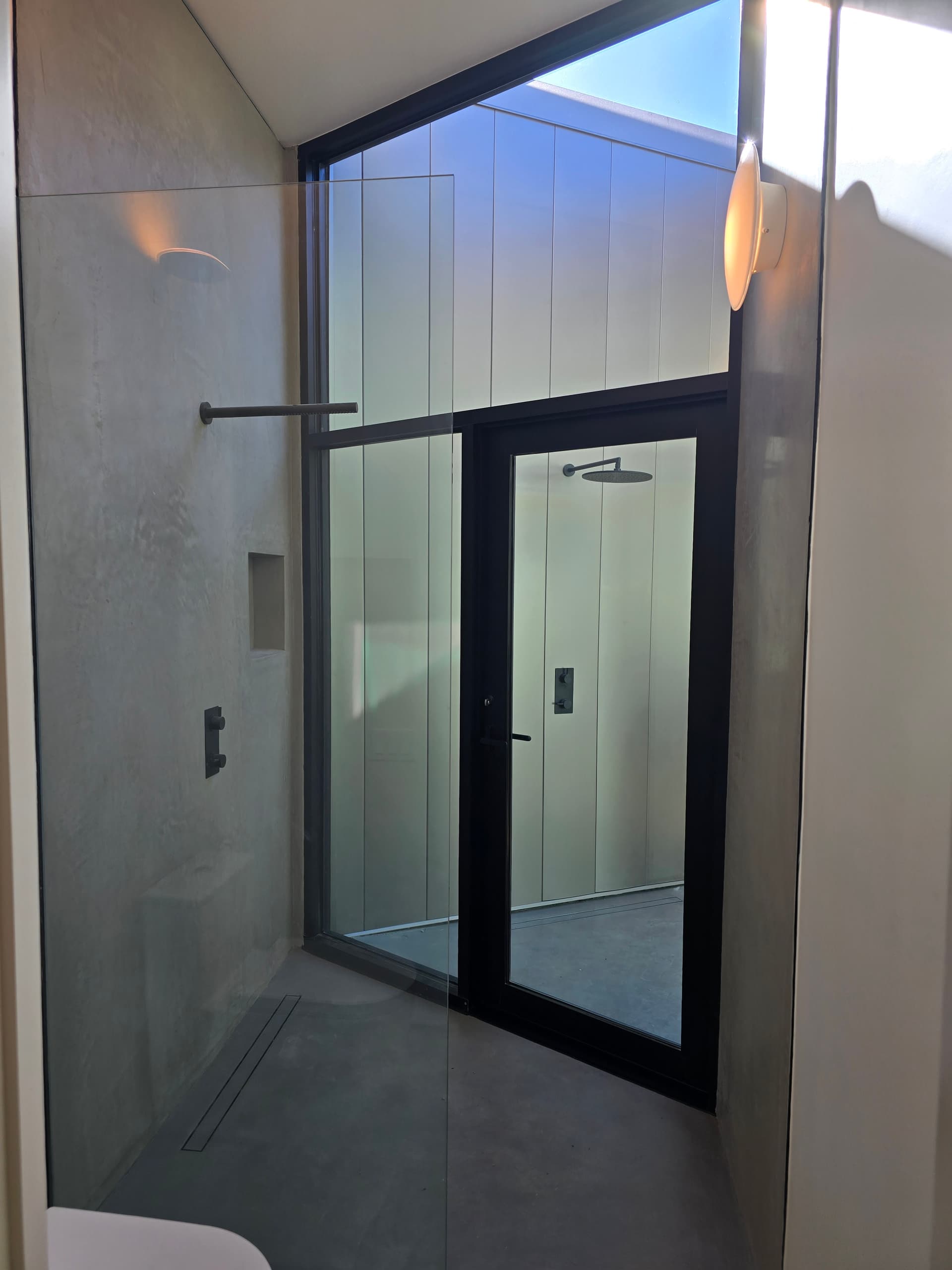 Glass entry door with black frame